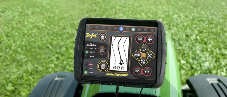 Modern tractor working the field